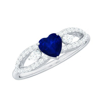 Real 0.6 carat blue sapphire and diamond heart promise ring with split shank by Rosec Jewels, featuring a romantic design and sparkling stones.