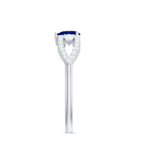 Real 0.6 carat blue sapphire and diamond heart promise ring with split shank by Rosec Jewels, showcasing a sparkling gemstone design.