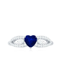 Real 0.6 carat blue sapphire and diamond heart promise ring with split shank by Rosec Jewels, featuring a delicate design and sparkling stones.