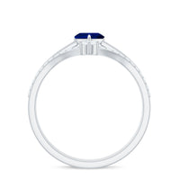 Heart-shaped blue sapphire solitaire wedding ring set with diamond accents from Rosec Jewels, featuring a silver band and elegant design.