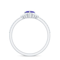 Natural Tanzanite and diamond heart promise ring for engagement on a silver band, showcasing a delicate and elegant design.