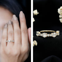 Round moissanite half eternity wedding band by Rosec Jewels, featuring sparkling stones set in a sleek gold ring.