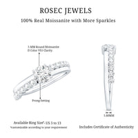 Round cut moissanite engagement ring with side stones from Rosec Jewels, featuring a sparkling center stone and elegant band.
