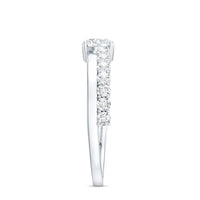Round cut moissanite engagement ring with side stones from Rosec Jewels, showcasing a sparkling center and elegant band design.