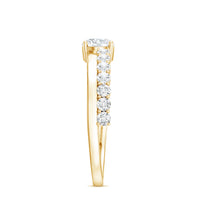 Round cut moissanite engagement ring with side stones from Rosec Jewels, featuring a sparkling central gemstone and elegant band design.