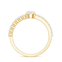 Round cut moissanite engagement ring with side stones by Rosec Jewels, showcasing a sparkling central gemstone and elegant band.