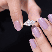 Certified 1.3 carat Moissanite pear-shaped engagement ring with trio setting from Rosec Jewels, showcasing the sparkling ring design.