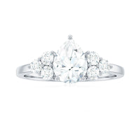 Certified 1.3 carat Moissanite pear-shaped engagement ring with trio gemstone accents, designed by Rosec Jewels.