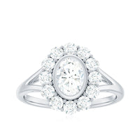 Oval cut moissanite halo engagement ring with split shank, featuring sparkling details and intricate band design by Rosec Jewels.