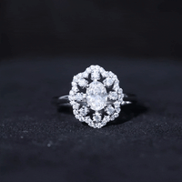 Oval Shaped Moissanite Flower Engagement Ring