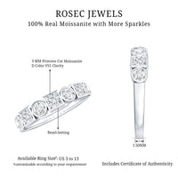 Rosec Jewels moissanite half eternity band ring with bezel-set stones, showcasing a sleek, elegant design on a plain background.