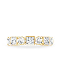 Rosec Jewels moissanite half eternity band ring with alternating bezel-set stones on a sleek gold band.