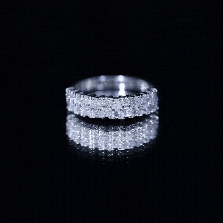 Rosec Jewels double row moissanite eternity wedding band with sparkling white stones on a sleek silver ring.