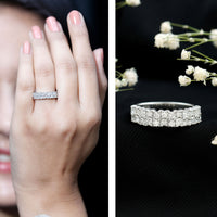 Double row moissanite eternity wedding band by Rosec Jewels featuring sparkling gemstones and polished silver finish.