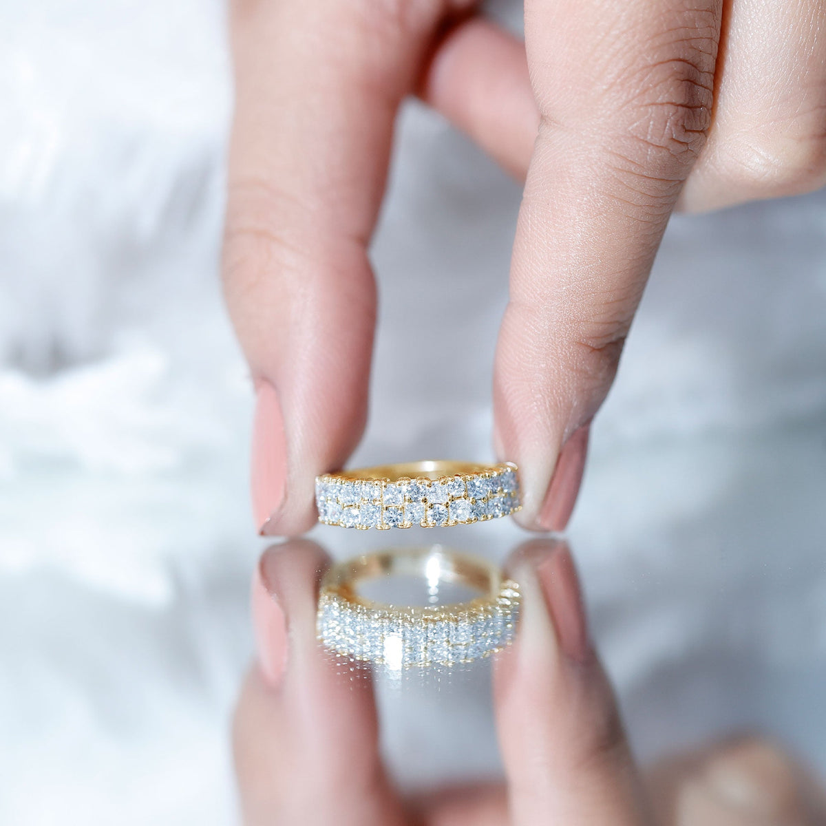 Double row moissanite eternity wedding band by Rosec Jewels featuring sparkling moissanite stones in a continuous circle.