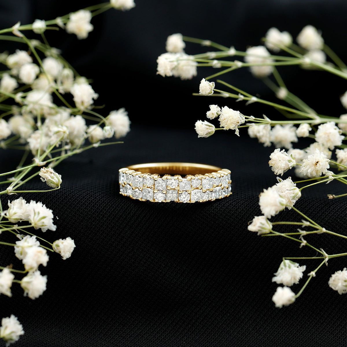 Double row moissanite eternity wedding band by Rosec Jewels, showcasing sparkling moissanite stones on a sleek silver ring.