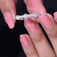 Yellow gold round cut moissanite half eternity band ring featuring sparkling stones and a sleek, polished design.