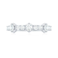 Round cut moissanite half eternity band ring by Rosec Jewels featuring a continuous row of sparkling stones on a sleek gold band.