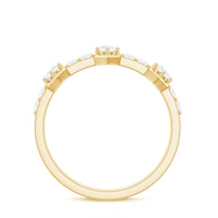 Round cut moissanite half eternity band ring featuring sparkling gemstones in a sleek gold setting.