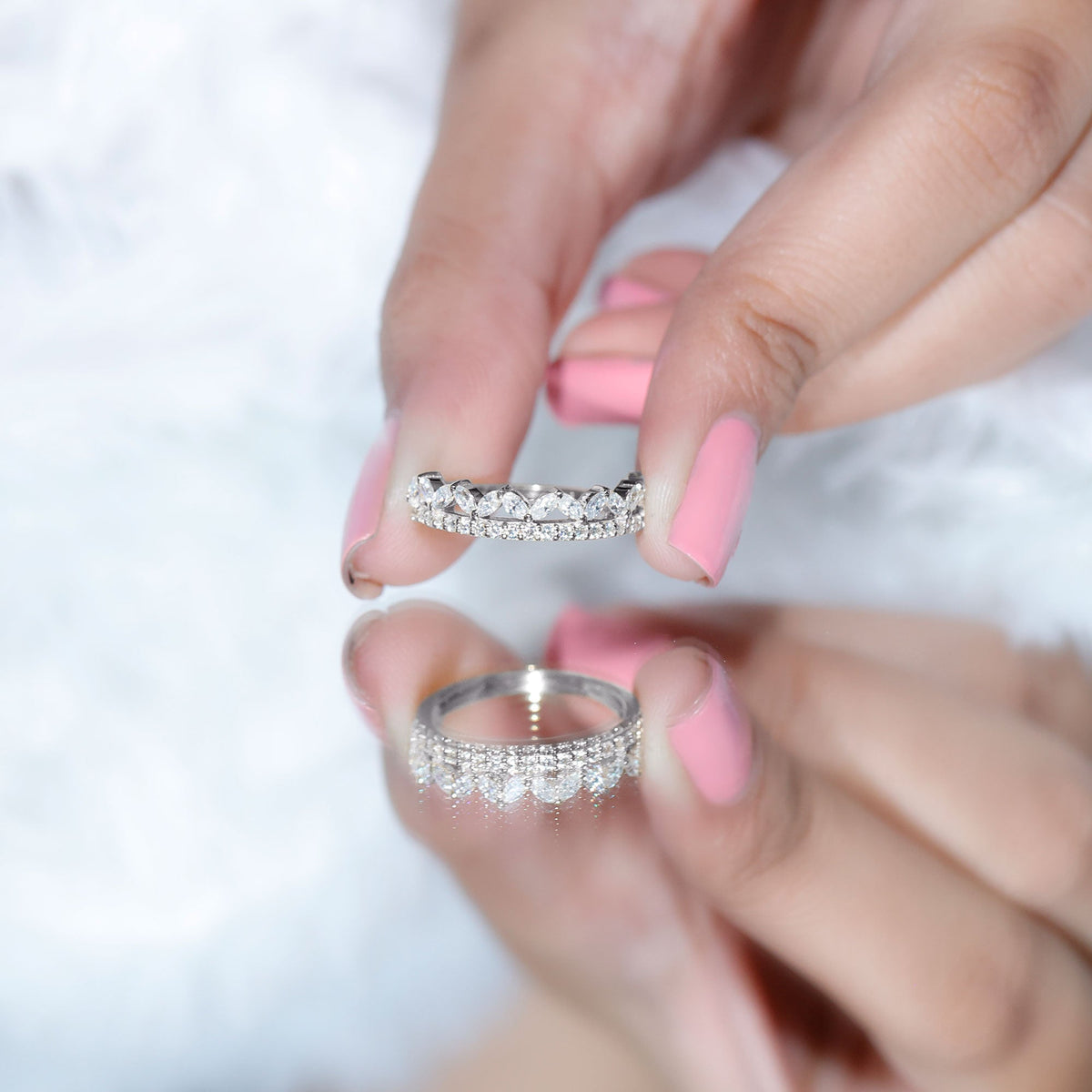 Rosec Jewels certified moissanite half eternity wedding band in crown style with sparkling stones and intricate design on a ring.