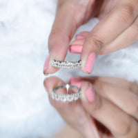 Rosec Jewels certified moissanite half eternity wedding band in crown style with sparkling stones and intricate design on a ring.