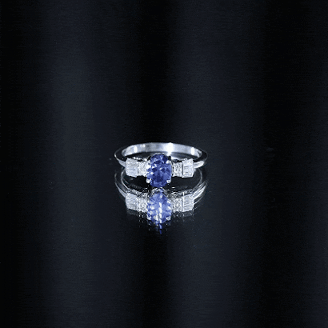 Oval lab-grown blue sapphire engagement ring with diamond accent, crafted by Rosec Jewels in yellow gold.