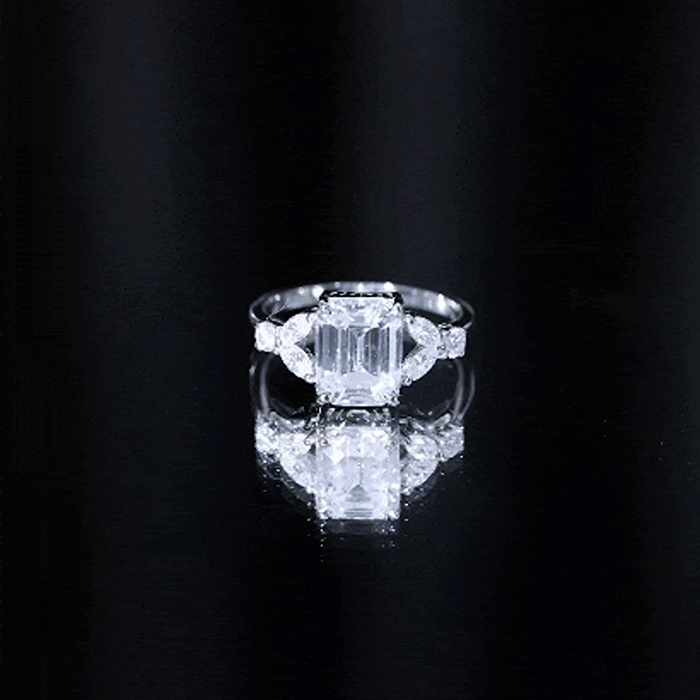 Yellow gold Claw Set Emerald Cut Moissanite engagement ring by Rosec Jewels featuring a central emerald-cut moissanite gemstone.