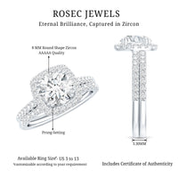 Silver cubic zirconia engagement ring with wedding band, featuring a 2-carat center stone and detailed band design.