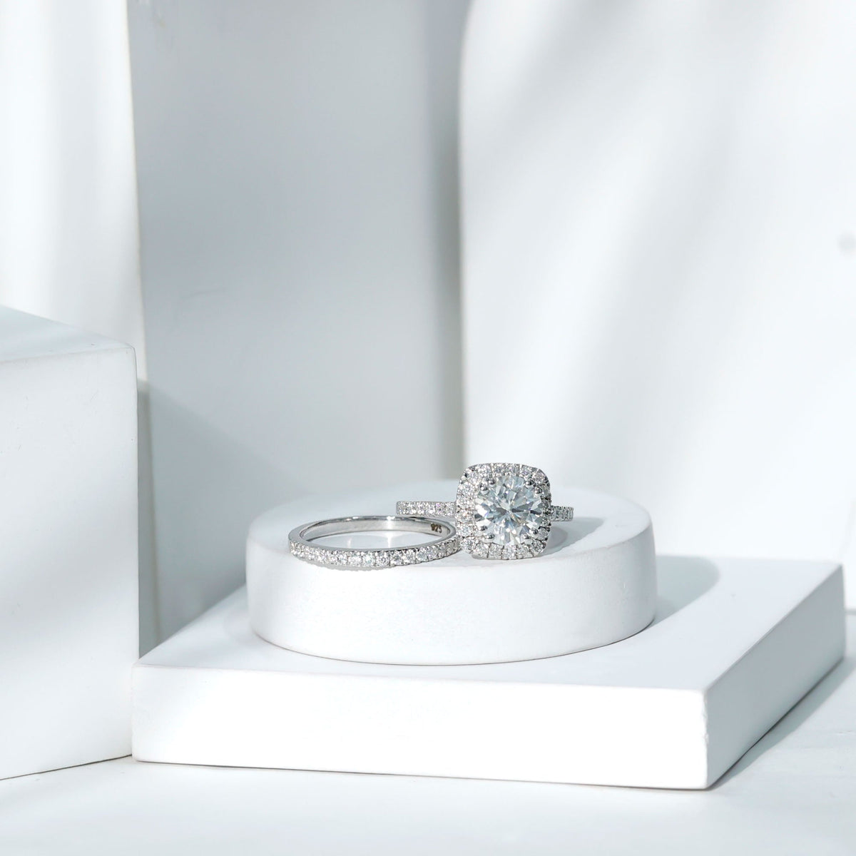 Silver 2 carat cubic zirconia engagement ring with matching wedding band, featuring sparkling stones, from Rosec Jewels.
