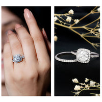 Two-carat cubic zirconia engagement ring with matching wedding band in silver, featuring sparkling stones and intricate band design.