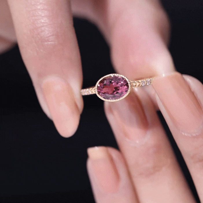 Oval pink tourmaline engagement ring with diamond accents, set east-west in rose gold from Rosec Jewels.