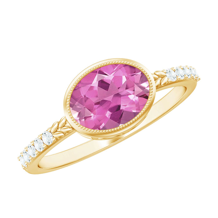 Oval 1-carat pink tourmaline engagement ring with diamond accents, featuring east-west design by Rosec Jewels.