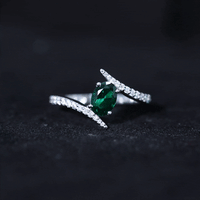 Certified 0.8 Carat Oval Cut Lab Grown Emerald Engagement Ring with Diamond Bypass Shank