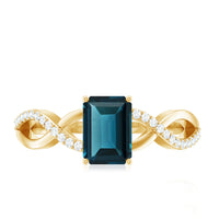 Solitaire Blue Topaz Emerald Cut Engagement Ring with Infinity Band