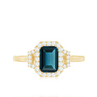 Emerald Cut Blue Topaz and Diamond Halo Engagement Ring