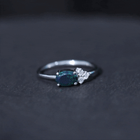 Oval Black Opal East West Ring with Diamond Trio