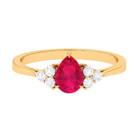 Natural 0.8 carat Ruby teardrop engagement ring with diamond trio accents, crafted by Rosec Jewels, featuring a elegant and vibrant design.
