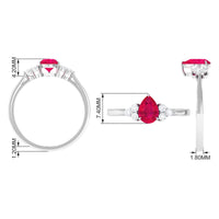 Natural 0.8 carat ruby teardrop engagement ring with diamond trio from Rosec Jewels, showcasing the elegant gemstone design.