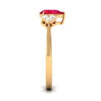 Natural 0.8 carat ruby teardrop engagement ring with diamond trio by Rosec Jewels, featuring a striking ruby and sparkling diamonds.