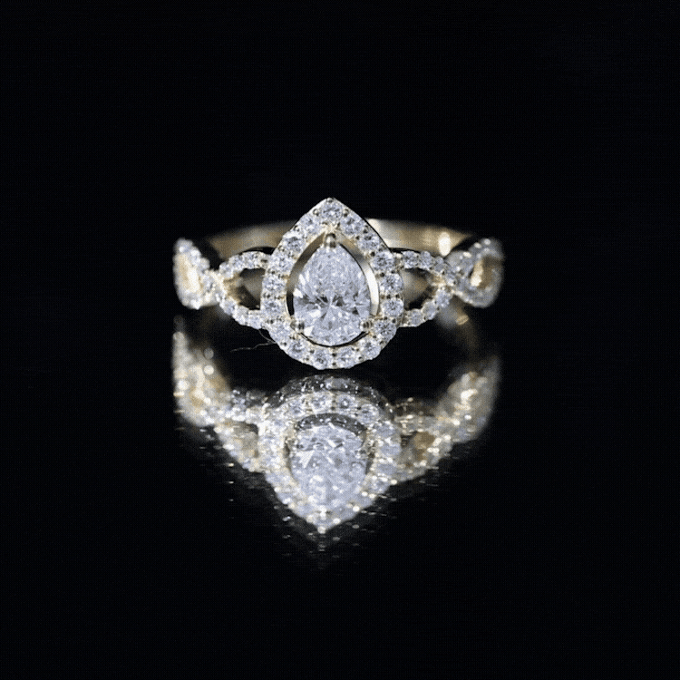 Yellow gold pear-shaped lab-grown diamond teardrop engagement ring by Rosec Jewels featuring a sparkling diamond centerpiece.
