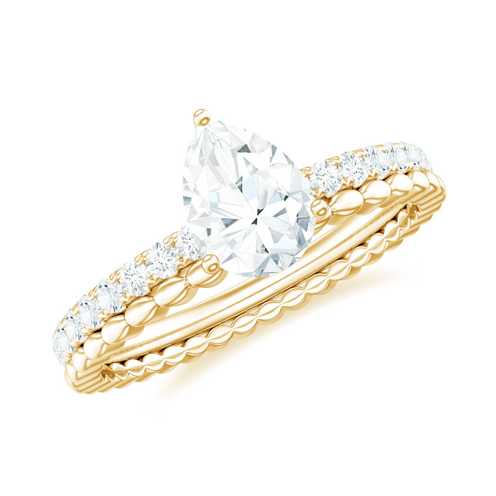 Pear shape lab-grown diamond solitaire engagement ring from Rosec Jewels with a delicate band and sparkling diamond centerpiece.
