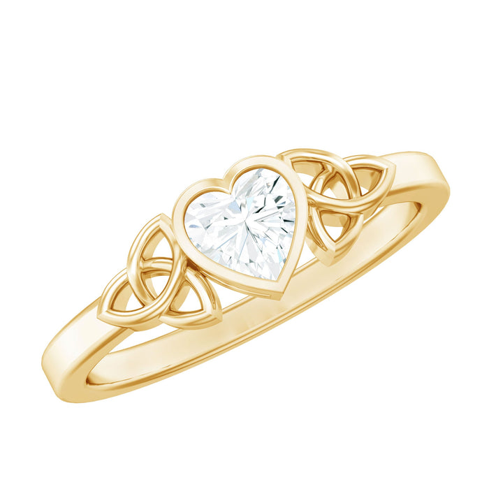 Heart-shaped lab-grown diamond solitaire Celtic ring by Rosec Jewels, featuring intricate Celtic knot detailing on sterling silver band.