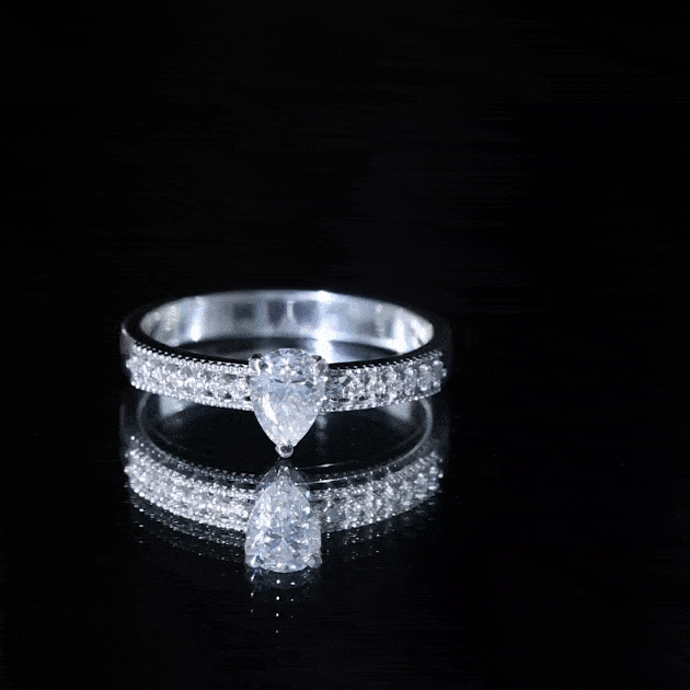 Yellow pear-shaped lab-grown diamond solitaire engagement ring by Rosec Jewels featuring a yellow diamond on a sleek band.