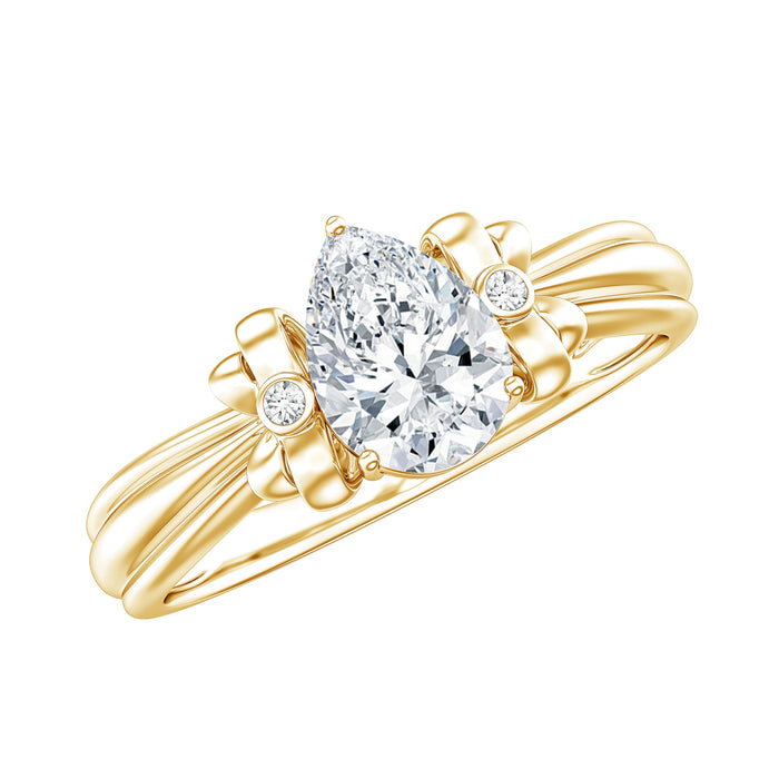 Pear cut lab grown diamond solitaire engagement ring with a bow design by Rosec Jewels, showcasing the elegant ring on a white background.