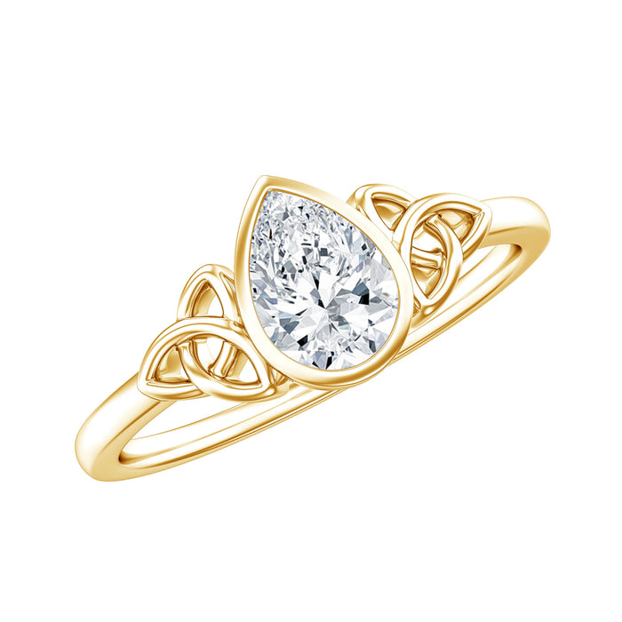 Pear-shaped lab-grown diamond solitaire Celtic ring by Rosec Jewels, featuring intricate Celtic design on a gold band.
