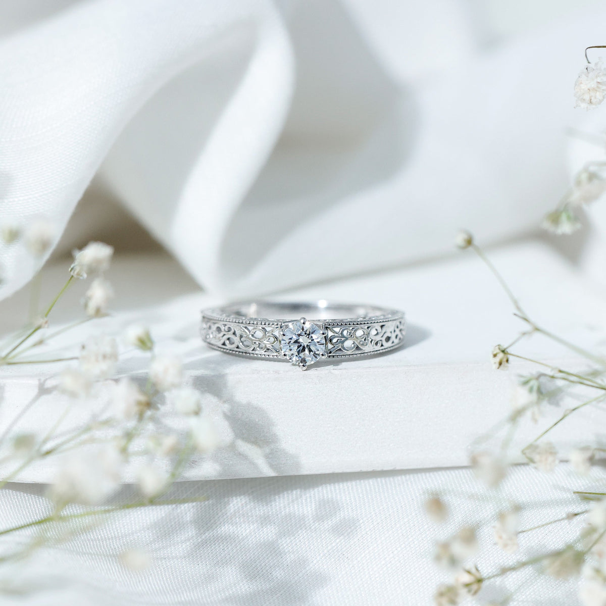 Vintage-inspired solitaire lab-grown diamond filigree ring by Rosec Jewels featuring intricate metalwork and a central sparkling diamond.