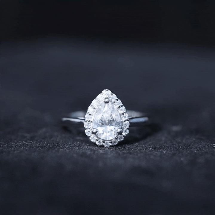 Yellow gold lab-grown diamond teardrop engagement ring with halo setting from Rosec Jewels, showcasing intricate design and sparkling stones.