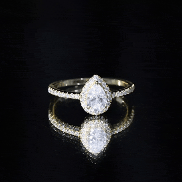 Yellow gold lab-grown diamond pear engagement ring with halo setting by Rosec Jewels, showcasing the elegant design and sparkling stones.