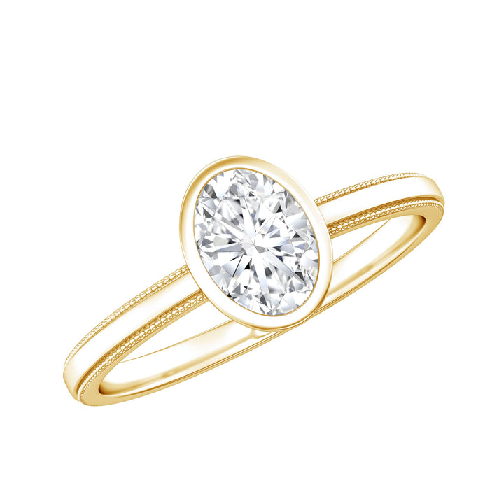 Oval lab-grown diamond solitaire ring with bezel setting by Rosec Jewels, showcasing a sparkling central stone on a sleek band.