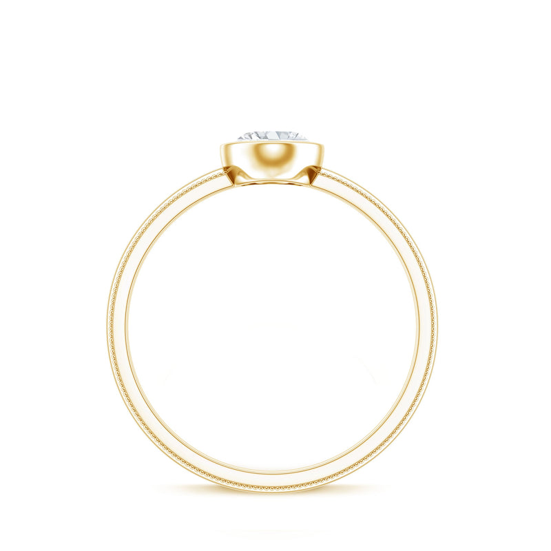 Bezel set oval lab-grown diamond solitaire ring by Rosec Jewels featuring a sleek gold band and a central sparkling diamond.